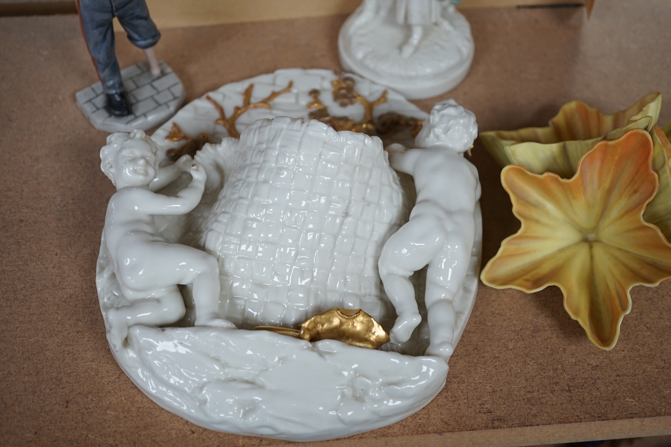 A Royal Worcester gilt figural wall pocket, two figures and a petal ornament, largest 22cm high. Condition - fair to good